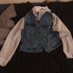 a jean jacket with a fluffy sleeve and hood from wax jean